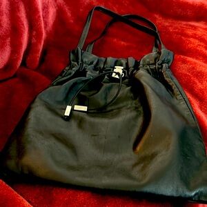 Salvatore Ferragamo black leather tote 24”handles cloth interior12”x13”pristine